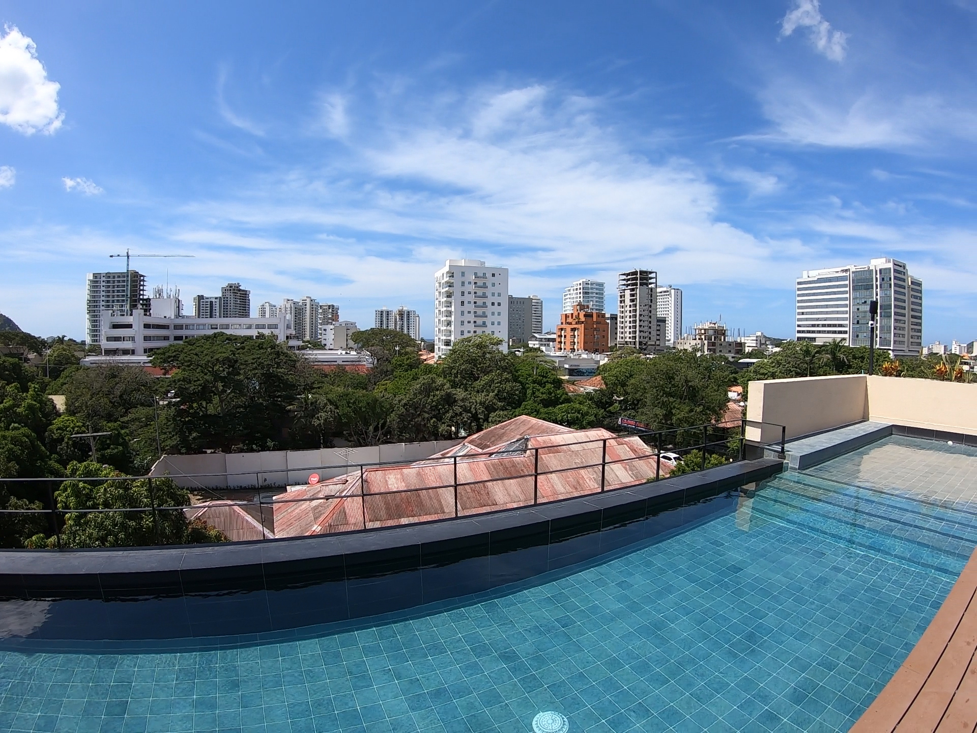A rooftop pool with a view of the tall buildings in the city of Santa Marta, Colombia.